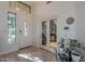 Bright foyer features a glass-paneled front door, decorative tile flooring, and an office through glass French doors at 2418 E Glass Ln, Phoenix, AZ 85042