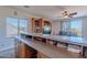 Well-lit living area with a built-in entertainment center and views from the countertop at 2418 E Glass Ln, Phoenix, AZ 85042