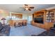 Cozy living room featuring a wet bar and entertainment center with a large screen TV at 2418 E Glass Ln, Phoenix, AZ 85042