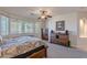 Bright main bedroom with large windows, neutral carpet, and wood accents at 2418 E Glass Ln, Phoenix, AZ 85042