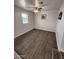 Bright bedroom with wood-look flooring and ceiling fan at 2523 N 28Th St, Phoenix, AZ 85008