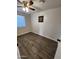 Spacious bedroom featuring wood-look floors and ceiling fan at 2523 N 28Th St, Phoenix, AZ 85008