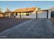 Newly renovated single story home with attached garage and paved driveway at 2523 N 28Th St, Phoenix, AZ 85008