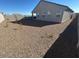 Landscaped backyard with gravel and small plants at 25512 N 183Rd Ln, Wittmann, AZ 85361