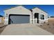 New single-story home with a two-car garage and neutral color scheme at 25512 N 183Rd Ln, Wittmann, AZ 85361