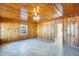 Living room with wood paneled walls and ceiling at 26207 S Lime Dr, Queen Creek, AZ 85142