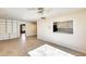 Living room with built-in shelving and kitchen view at 26207 S Lime Dr, Queen Creek, AZ 85142