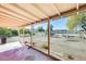 Covered patio with view of the backyard and a white fence at 26207 S Lime Dr, Queen Creek, AZ 85142