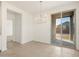 Spacious dining area with sliding glass doors and modern chandelier at 2669 E Santa Ynez Dr, Casa Grande, AZ 85194