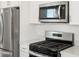 Stainless steel appliances, including microwave, range, and refrigerator, are featured in this kitchen at 2669 E Santa Ynez Dr, Casa Grande, AZ 85194