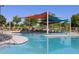 Relaxing pool area with shade structures and a water feature at 2669 E Santa Ynez Dr, Casa Grande, AZ 85194