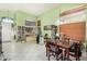 Dining area with a wooden table and chairs, adjacent to an entryway at 2673 W Ivanhoe St, Chandler, AZ 85224