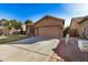 Exterior view of the house with a driveway and a two-car garage at 2673 W Ivanhoe St, Chandler, AZ 85224