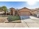 House exterior showing a well-maintained lawn and a two-car garage at 2673 W Ivanhoe St, Chandler, AZ 85224