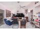 Gathering room with a ceiling fan, large TV, and built-in shelving at 2673 W Ivanhoe St, Chandler, AZ 85224