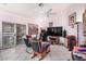 Bright Gathering room with ceiling fan, built-in shelving and sliding glass door at 2673 W Ivanhoe St, Chandler, AZ 85224