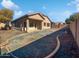 Landscaped backyard with covered patio and gravel at 3057 E Superior Rd, San Tan Valley, AZ 85143