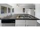 Kitchen island with granite countertop and double sink at 3057 E Superior Rd, San Tan Valley, AZ 85143