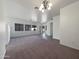 Living room with chandelier and view to entryway at 3057 E Superior Rd, San Tan Valley, AZ 85143