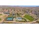 Aerial view of community amenities including tennis courts, basketball court and large grassy area at 32029 N 19Th Ln, Phoenix, AZ 85085