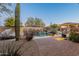 Landscaped backyard with a pool, a brick patio, and desert landscaping at 32029 N 19Th Ln, Phoenix, AZ 85085