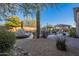 Landscaped backyard with a pool and relaxing area at 32029 N 19Th Ln, Phoenix, AZ 85085