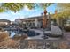 Inviting backyard oasis featuring a sparkling pool, ample lounge space, and desert landscaping at 32029 N 19Th Ln, Phoenix, AZ 85085