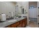 Bathroom with and sinks and wood cabinets at 32029 N 19Th Ln, Phoenix, AZ 85085