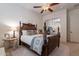 Bedroom with a large wooden bed and ceiling fan at 32029 N 19Th Ln, Phoenix, AZ 85085