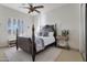 Spacious bedroom with a large four-poster bed and plenty of natural light at 32029 N 19Th Ln, Phoenix, AZ 85085