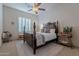 Bedroom with a large wooden bed and ceiling fan at 32029 N 19Th Ln, Phoenix, AZ 85085