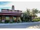 Community clubhouse with rustic architecture and landscaping at 32029 N 19Th Ln, Phoenix, AZ 85085