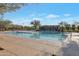 Large community pool with plenty of lounge chairs and umbrellas at 32029 N 19Th Ln, Phoenix, AZ 85085