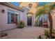 Inviting front courtyard with brick pavers and lush landscaping at 32029 N 19Th Ln, Phoenix, AZ 85085