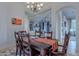 Elegant dining room features a wood table, orange runner, and chandelier at 32029 N 19Th Ln, Phoenix, AZ 85085