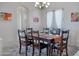 Bright dining room with wood table and access to outdoor patio at 32029 N 19Th Ln, Phoenix, AZ 85085