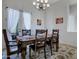 Formal dining room featuring a wood table and chandelier at 32029 N 19Th Ln, Phoenix, AZ 85085