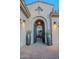 Elegant entryway with arched gate and large planters at 32029 N 19Th Ln, Phoenix, AZ 85085