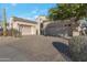 Tan stucco house with two-car garage and paved driveway at 32029 N 19Th Ln, Phoenix, AZ 85085