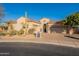 Stunning desert home with tile roof, arched entry, and landscaped front yard at 32029 N 19Th Ln, Phoenix, AZ 85085