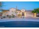 Single story home with an arched entry and desert landscaping at dusk at 32029 N 19Th Ln, Phoenix, AZ 85085