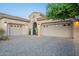 Two-car garage with decorative doors and brick driveway at 32029 N 19Th Ln, Phoenix, AZ 85085