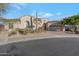 Single-story home with stucco exterior, tile roof, and landscaped front yard at 32029 N 19Th Ln, Phoenix, AZ 85085