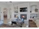 Elegant fireplace with built-in shelving and media center at 32029 N 19Th Ln, Phoenix, AZ 85085