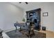 Home office with large desk, built-in shelving, and ceiling fan at 32029 N 19Th Ln, Phoenix, AZ 85085