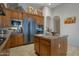 Modern kitchen with stainless steel appliances and island at 32029 N 19Th Ln, Phoenix, AZ 85085