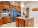 Eat-in kitchen boasts stainless steel appliances and granite island at 32029 N 19Th Ln, Phoenix, AZ 85085