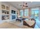 Living room with a fireplace, built-in shelving, and a leather couch at 32029 N 19Th Ln, Phoenix, AZ 85085