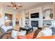 Comfortable living room with leather sectional and a view into the kitchen at 32029 N 19Th Ln, Phoenix, AZ 85085