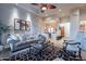 Living room with comfy seating, large windows, and view into dining area at 32029 N 19Th Ln, Phoenix, AZ 85085